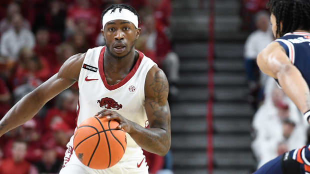 Arkansas guard Davonte Davis brings the ball up the court against Auburn.